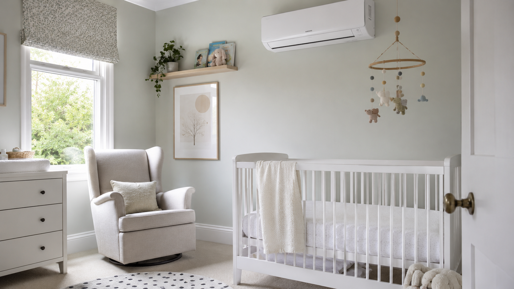 Nursery with a white cot and a wall-mounted air conditioning unit holding the room at a safe sleeping temperature